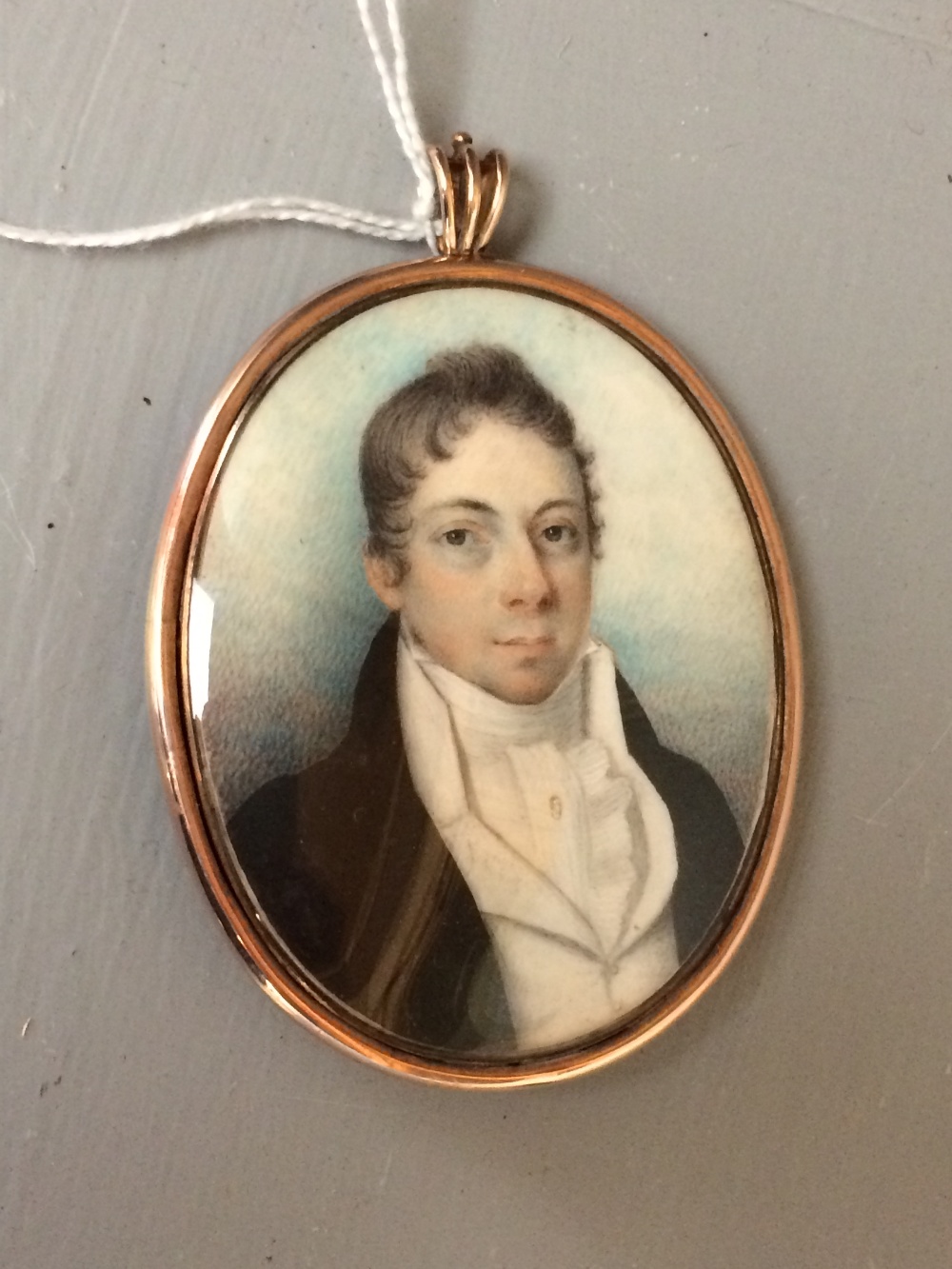 Georgian oval miniature of a gentleman, lock of hair verso initialed JM