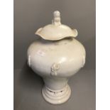 White lidded Chinese urn 50cm H, decorated with figures, the lid topped with a dog of Fo