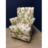 Small tub chair upholstered in a butterfly & flower pattern