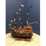 Hand crafted by a local vendor, a Galleon Ship, with wooden frame & cloth & string masts bearing