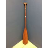 Carved Indonesian paddle with carved finial