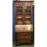 Oak bureau bookcase , the upper half glazed with Art Nouveau style lead inserts, & oak beading to