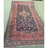 Persian rug geometrically decorated in shades of red, blue & beige 470 X 204cm