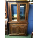 1940s Oak or elm display cupboard, the upper glazed section with mirrored back & glass shelves