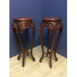 Pair of ornate wooden display stands for vases 82cm H