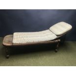 Bergère day bed with blue gingham cushions 72Wx205Lx47H cm