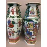 Oriental near pair of modern hexagonal vases depicting figures & scenes of domesticity 44H cm