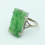 Ring carved jadeite plaque, set in unmarked white metal size P, 2.3g