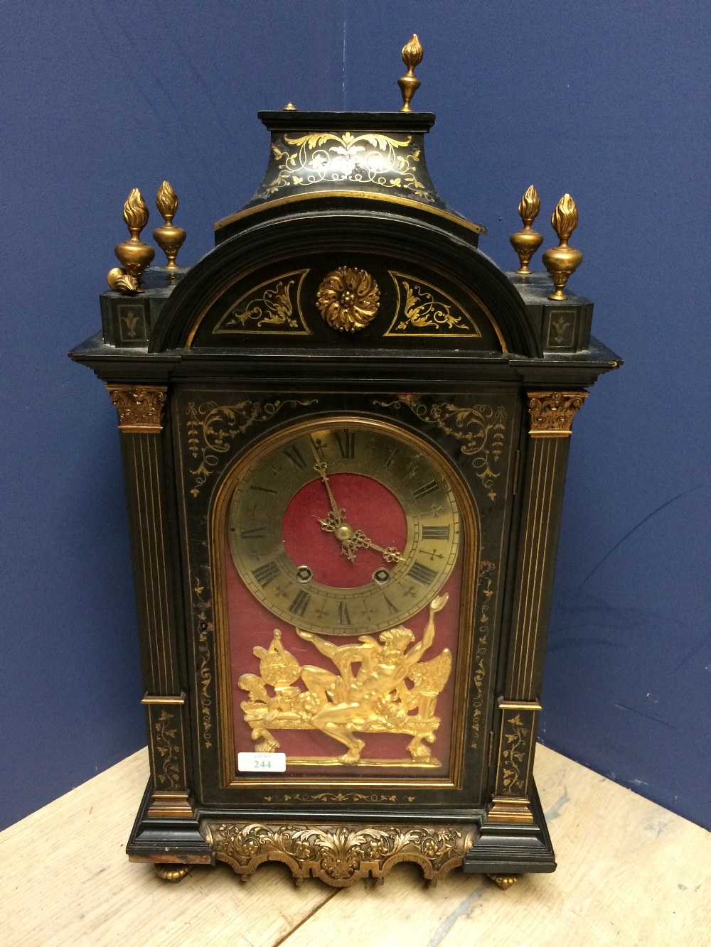 C19th ebony and boullework bracket clock, the hinged front door revealing a brass open circular dial