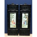 Pair of Oriental porcelain plaques 41 X 17cm in fretted & ebonised frames