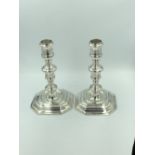 Pair of cast Britannia standard silver candlesticks in William III style, baluster turned stems &