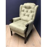 As new green upholstered arm chair
