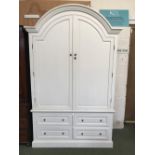 White painted wardrobe, with 2 arched doors, opening to reveal shelves above 4 drawers to base 220 h