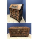 Chinese hardwood bureau the fall flap profusely carved with Chinese scenes, & a camphor wood chest