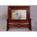 C20th Chinese famille rose plaque mounted as a table screen, decorated with a figural scene in a