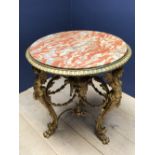 Decorative circular Ormolu table, with central marble panel in vibrant oranges and greys, the