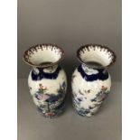 Pair of Chinese early C20th vases with all over decoration of birds, flowers & foliage 38 cm
