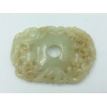 Chinese Jade carved oval disc with central hole 7cm