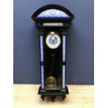 Vienna regulator clock with blue/white porcelain face & the black glazed case embellished with