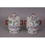 A pair of C19th Chinese famille rose jars and covers painted with a lady seated under a plantain