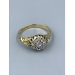 18ct gold & diamond cluster ring, central old cushion cut diamond with a surround of 8 old cut