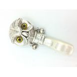 Silver babies rattle in the form of an owl with glass eyes