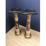 Pair of tall decorative torcheres with marble tops