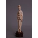 C19th Chinese ivory carving group of a lady and a boy, wood stand, overall 24cm high.