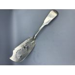 William IV Irish silver fish slice fiddle pattern handle with Ostrich crest, pierced engraved blade,