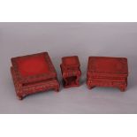 Three C19th Chinese carved cinnabar lacquer stands, 15cm wide max (3)