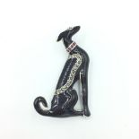 Silver enamel set brooch/pendant in the form of a greyhound with ruby collar