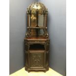 Victorian carved walnut corner cabinet with mirrored capola top