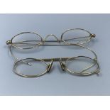 Pair of yellow metal wire framed spectacles and a pair of 14ct gold 'Pince-nez'