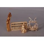 C19th Chinese ivory carving of a lady; together with a carved ivory Luohan, an ivory abacus, and a