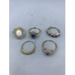 4 9ct gold & paste set rings & a silver synthetic opal ring