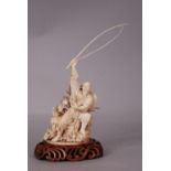 C19th Chinese ivory carving of a fisherman, his rod raised ablve his head with one hand and a fish