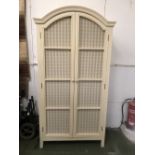 Cream painted wardrobe with 2 arched doors opening to reveal shelves ( 3 shelves & rail missing) 201