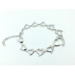 Silver heart shaped bracelet set with cubic zirconia's