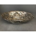 A Continental late C19th silver fruit basket with Repousse cherubs. The pierced sides with love