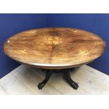 Walnut oval loo table with inlaid floral motifs, & a hardwood quadruple pedestal base