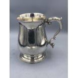 George III silver baluster tankard, with leaf capped cast scroll handle on a bead edge foot, 13.5