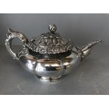 George IV Scottish silver teapot, melon panelled, leaf decorated spout, floral chased flange, the