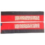 Pair of C19th sleeve bands, embroidered on a vivid red ground