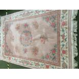 Large pink rug with white floral border 200 x 300cm