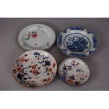 Four C18th Chinese dishes, comprising: a blue and white dish, a famille rose dish, and two