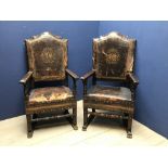 Pair of baronial leather & hard wood chairs with an armorial, possibly Spanish