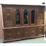 Very large & heavily carved contemporary Italian style wall unit, with 5 carved cupboards below a
