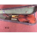 Violin with detached scroll in hard black case with bow as found