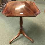 Attractive mahogany with fruit wood stringing, flip top candle table
