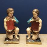 Pair of boys holding shields painted in natural colours 82cm